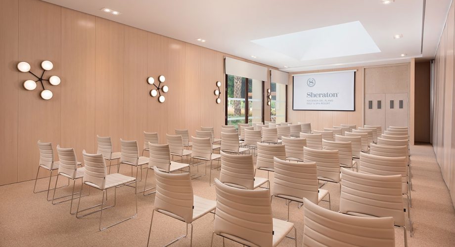 Conference room prepared for the morning business sessions